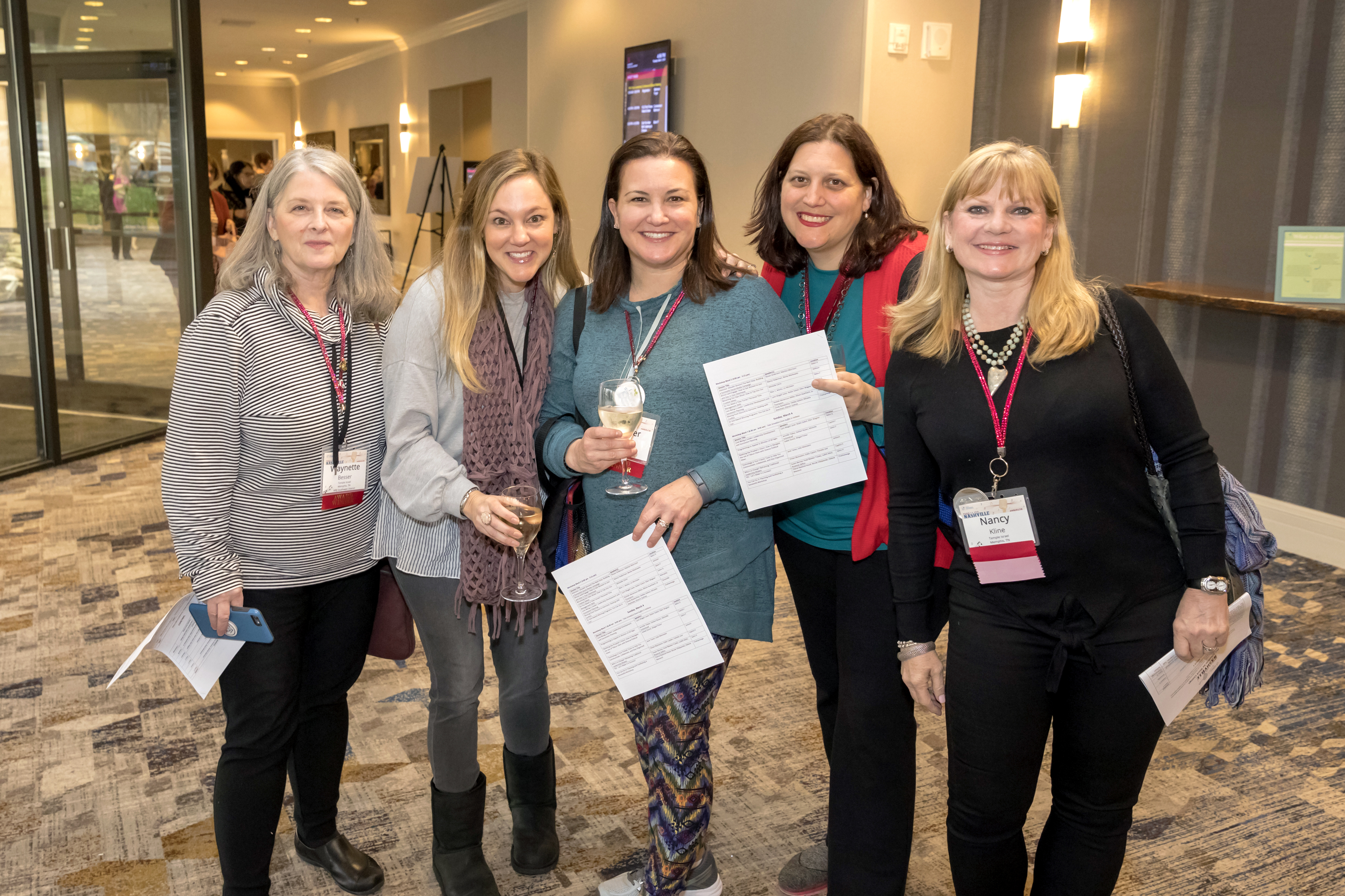 Young Women Smiling at a Conference