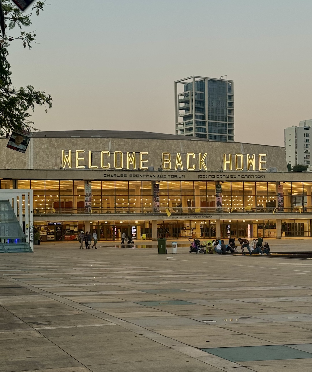 lit-up sign reading "Welcome Back Home" outside Habima, the National Theater in Tel Aviv