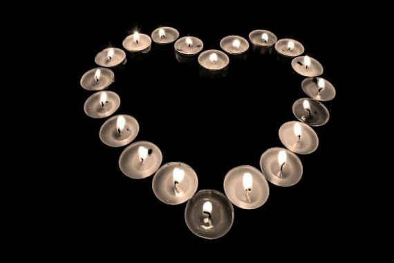 Small candles lit in the shape of a heart