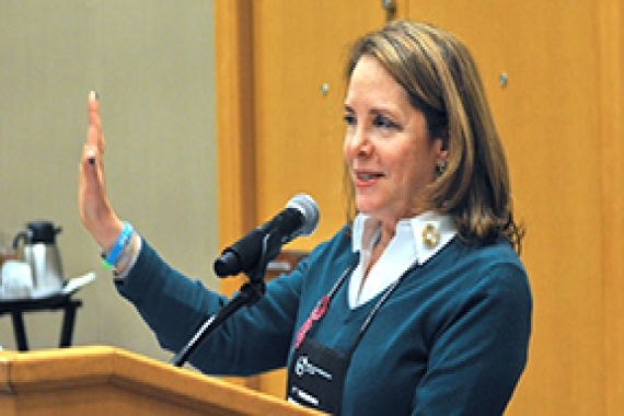 Susan Bass speaking from the podium