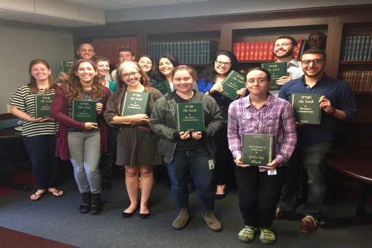 HUC Students holding "The Torah: A Women's Commentary"