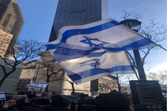 Israeli flags in front of a high-rise building in New York City