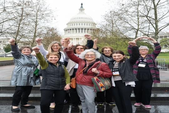 women and Phil McOsker from Ohio in front of the Capitol building in DC