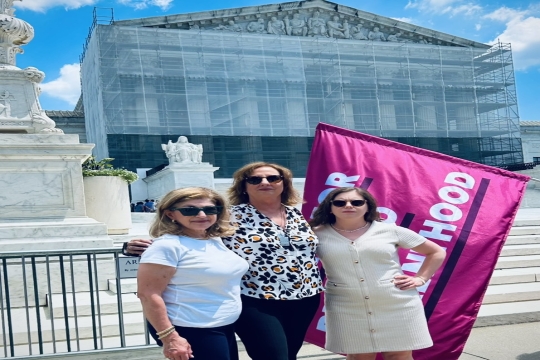 Karen Sim, Shelley Nicely Groff, and Liz P.G. Hirsch standing in front of the Supreme Court