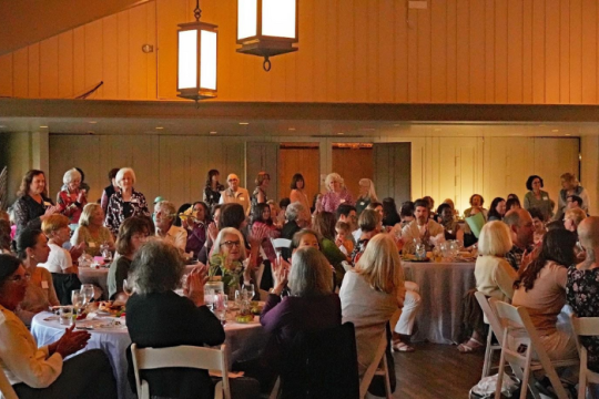 women in synagogue social room being honored