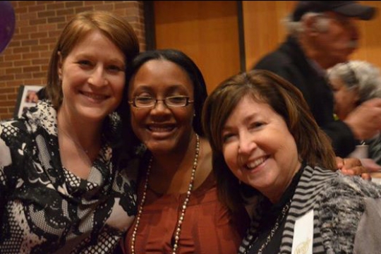 Three women hugging